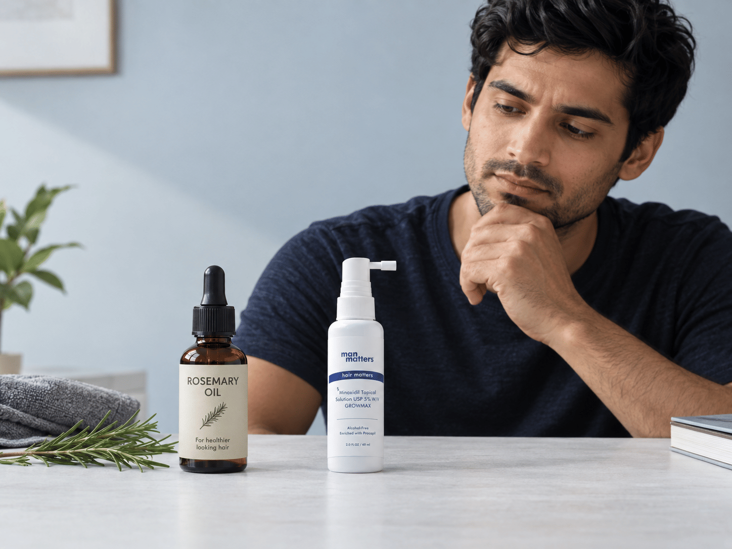 Man considering hair growth treatment options between Rosemary oil and minoxidil.