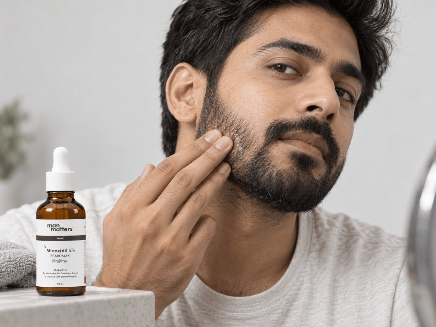 Man using Man Matters Beardmax growth serum for beard growth